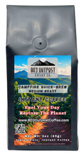 Campfire Quick-Brew medium roast instant coffee by 803 Outpost sitting on a rustic wooden table.